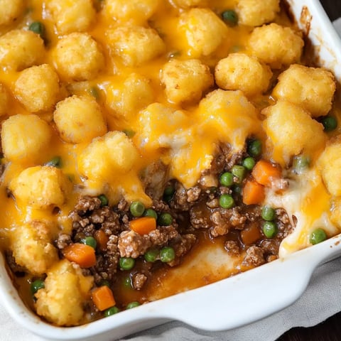 A bowl loaded with a hearty casserole.