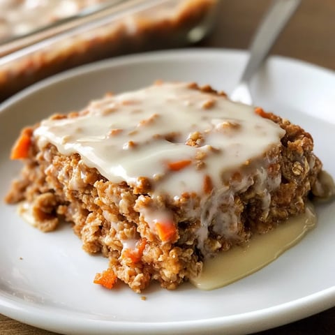A slice of cake with carrots on top.