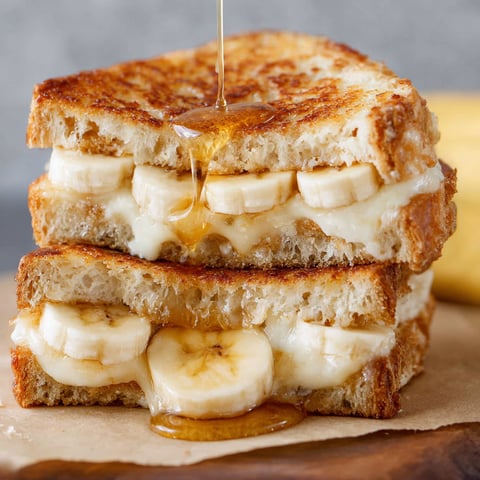 A grilled cheese sandwich with bananas and honey.