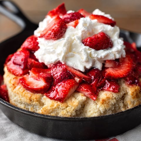 A skillet filled with strawberry shortcake.